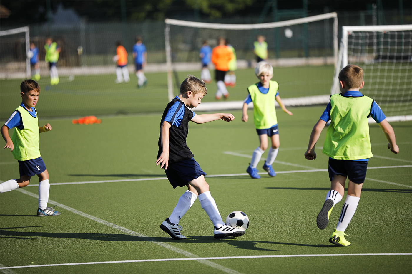 Child moving past defenders in football