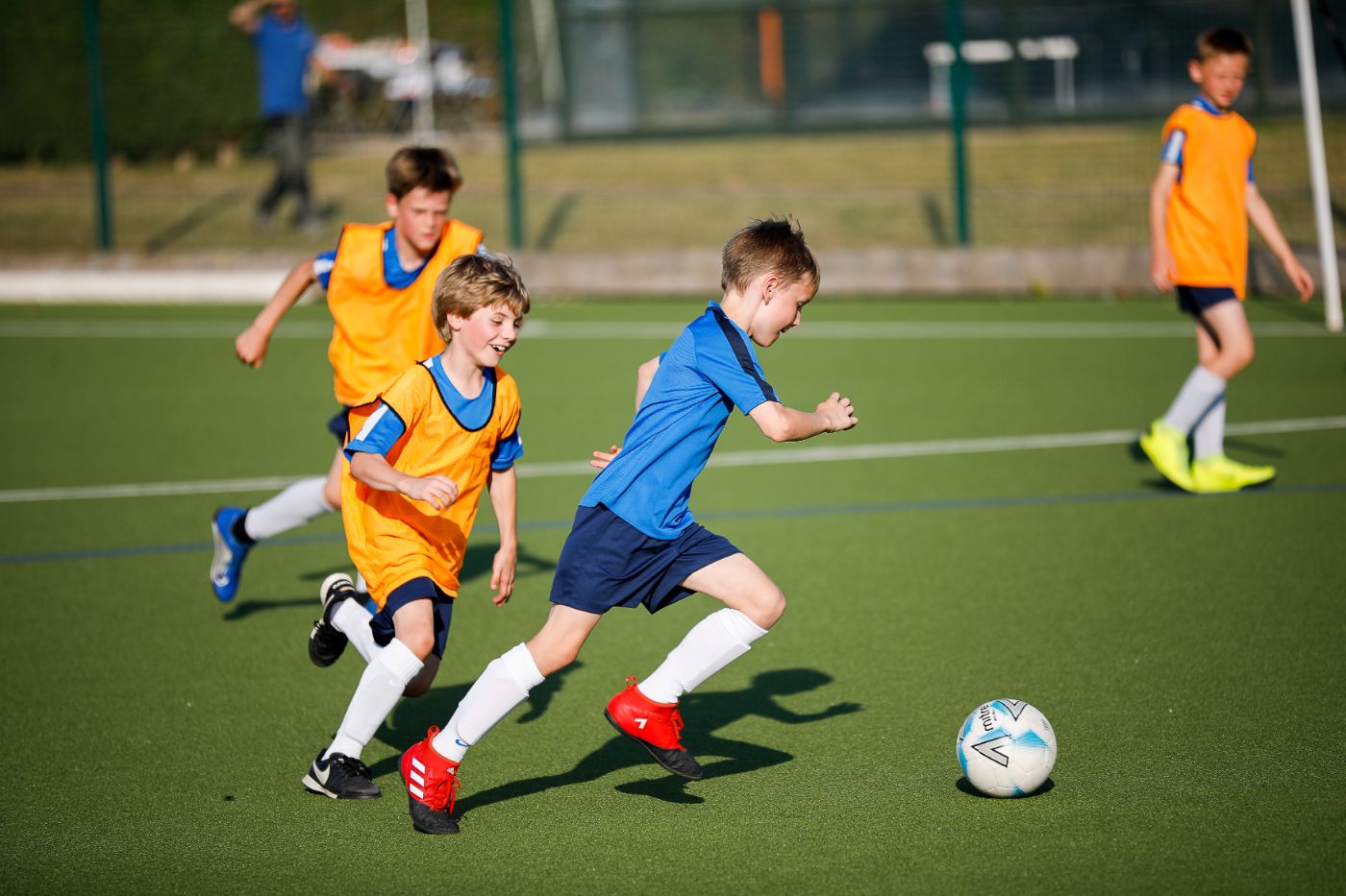 Children running with football